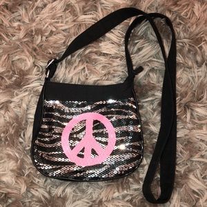 Sequin zebra peace sign cross body bag